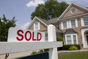 House with sold sign